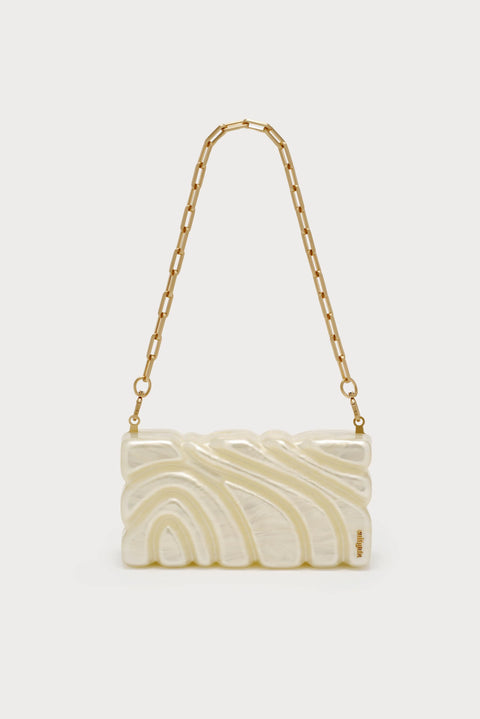 Textured pearlescent clutch with ornate design with chain strap showing.