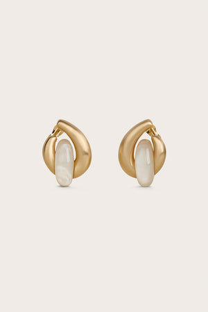 Round, gold statement earrings with an ivory pearlized piece in the center. 