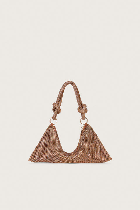 A dark champagne colored, rhinestone handbag that is slouchy in shape and features a knotted double strap, connected by two gold-toned rings. 