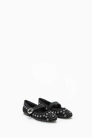 Black ballet flat shoes with silver stud floral patterns on a white background