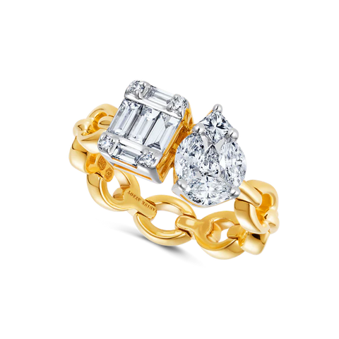 A yellow gold chain ring that features an illusion emerald cut diamond and an illusion pear diamond. 