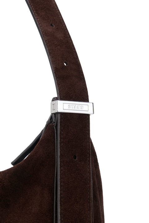 Brown leather bag with a silver buckle on a white background