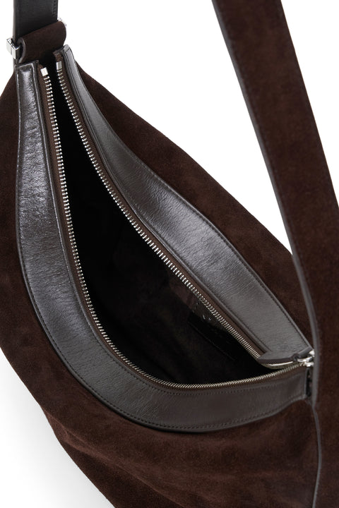 Brown leather bag with a visible zipper on a white background