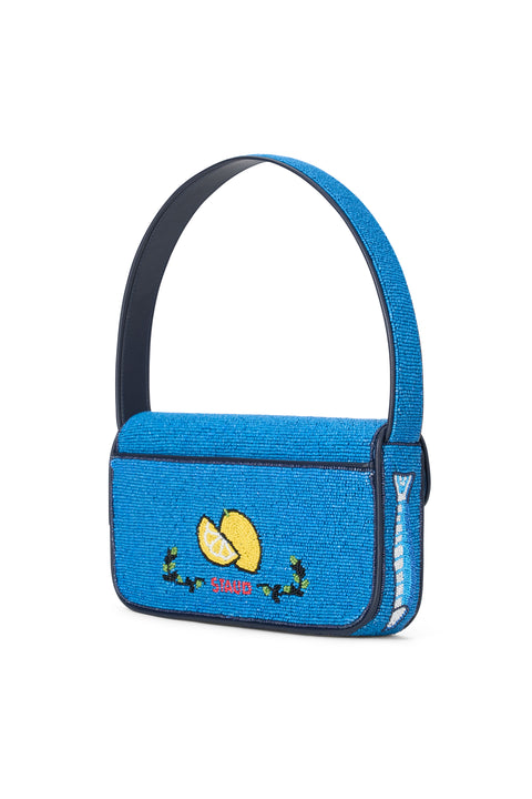 Blue handbag with a lemon design on a white background