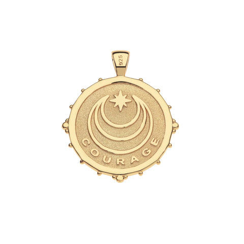 Gold pendant with 'COURAGE' engraving on a white background