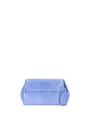 A light blue suede clutch bag with a small silver floral emblem on the front flap, set against a solid white background.