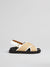  Side view of the fussbett sandals in black leather with raffia effect fabric.