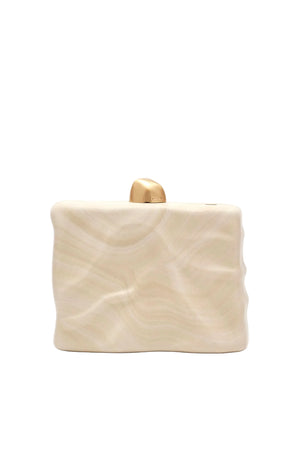 cream wavy clutch with gold knob detail.