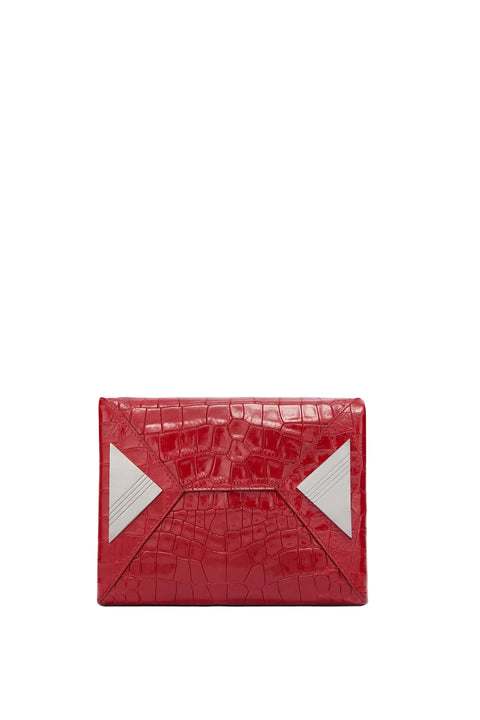 Red crocodile-patterned clutch bag on a light gray background