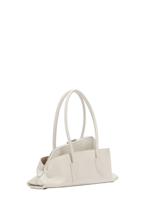 Back view of a white handbag on a white background