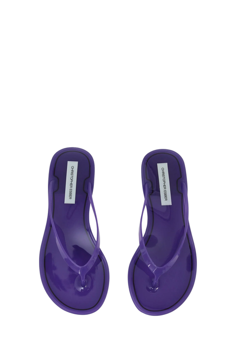 A pair of purple jelly thong sandals with black trim, shown from a top-down view on a white background. 