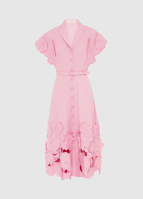 Pink short sleeve midi dress with thin belt and floral applique at the hem and sleeve.