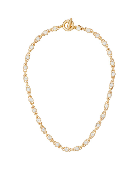 Gold chain necklace with crystal beads on a white background