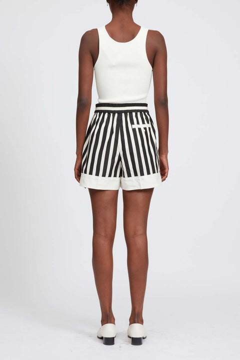 Back of model in striped shorts with white hem line and back pocket.