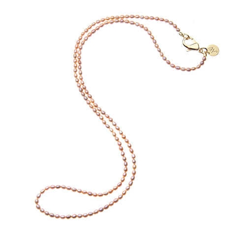 Pink pearl beaded necklace shown not wrapped.