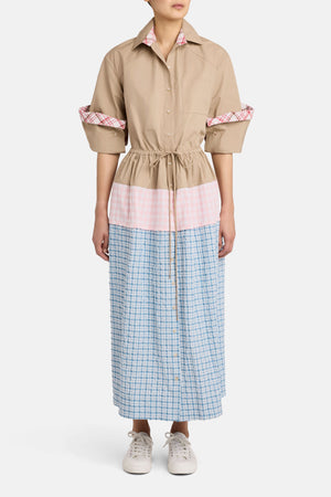 Model facing the camera in the midi dress with pink and blue gingham detailing