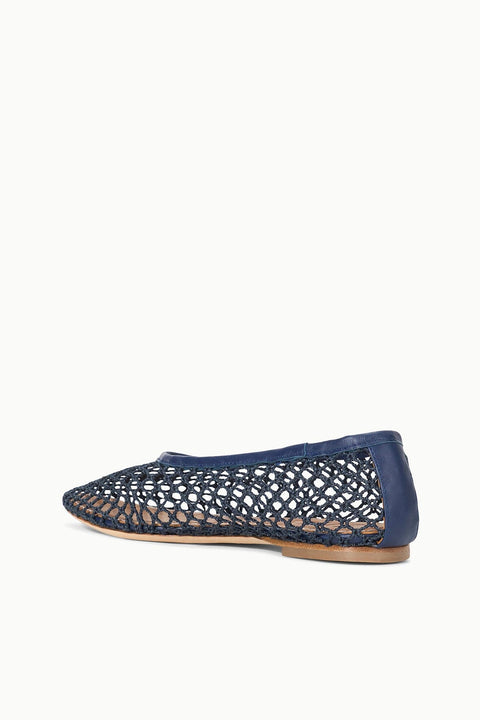 Navy blue woven flat shoe on a white background