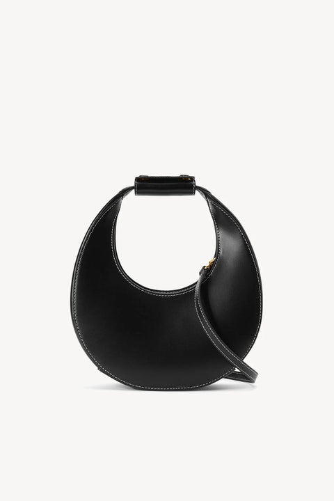 A small, black leather, moon-shaped handbag that features an optional crossbody strap. 