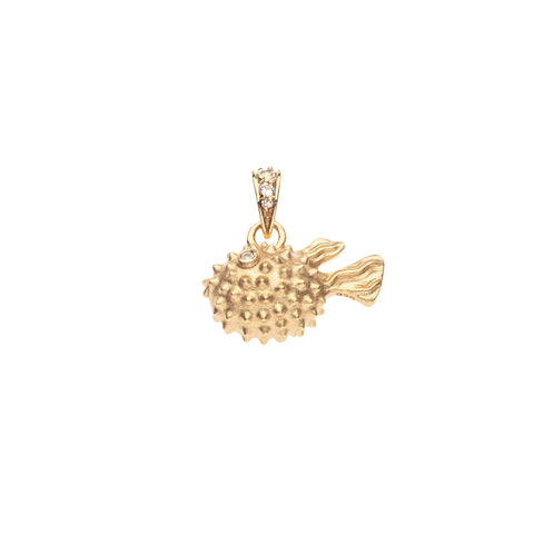 Gold puffer fish-shaped pendant with embedded stones on a white background