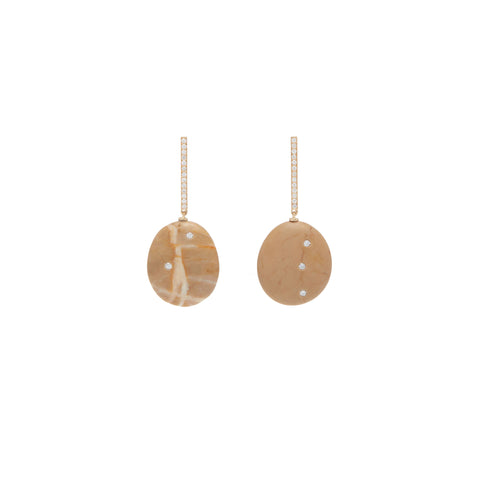 A pair of drop earrings that feature two irregular an stones embellished with small round diamonds and hanging from a pave diamond bar. 