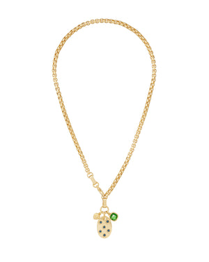 A gold-tone chain necklace that features a star-set sapphire pendant with an emerald charm. 