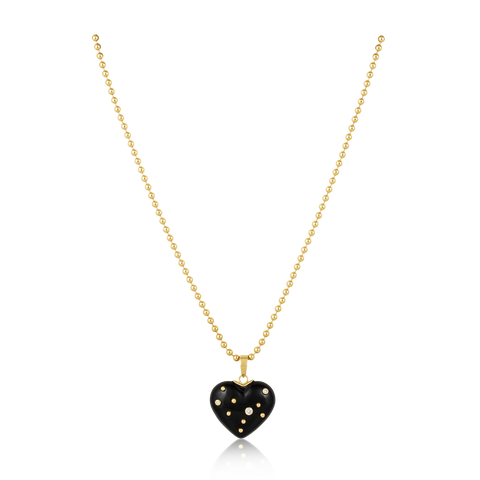 Gold necklace with a black heart-shaped pendant on a white background