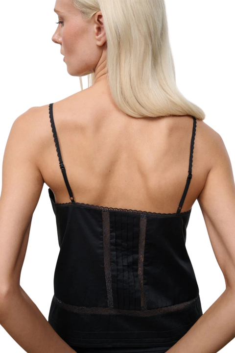 The back of a black sleeveless top with embroidery and lace details