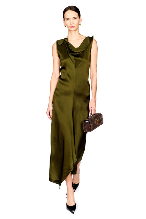 A model wearing a sleeveless olive green satin midi dress with a draped cowl neckline, holding a dark brown textured clutch bag against a solid white background.