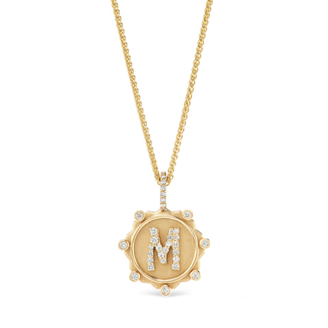 Image showing the charm sampled with the letter "M" and placed on a chain.  